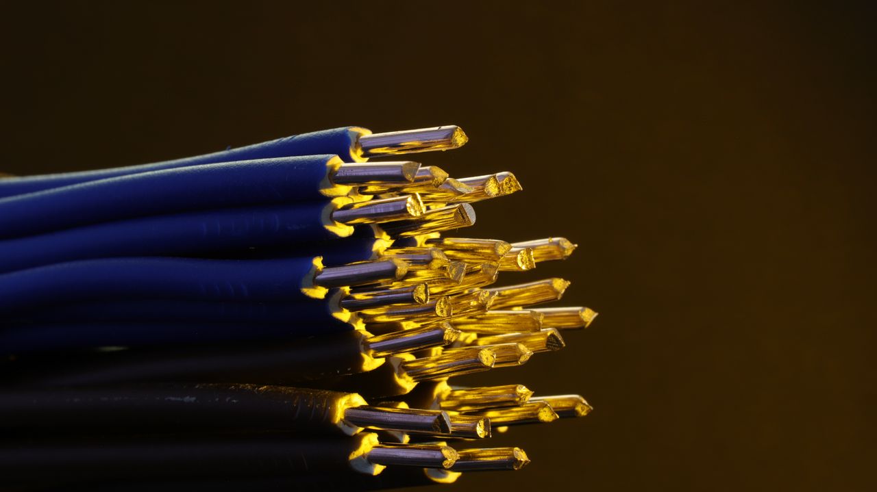 The Art of Drawing Readers In: Your attractive post title goes here Detailed view of blue ethernet cables with exposed gold-plated conductors.